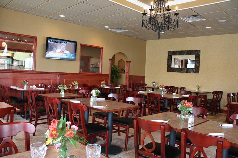 Dining room with many set tables